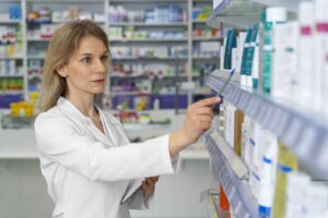 medium shot pharmacist working
